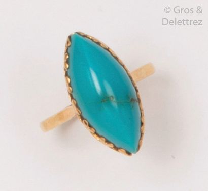 null Ring " Navette " in yellow gold, decorated with a turquoise cabochon. Tour of...