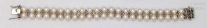 null Bracelet of two rows of cultured pearls alternating with rose-cut diamonds....