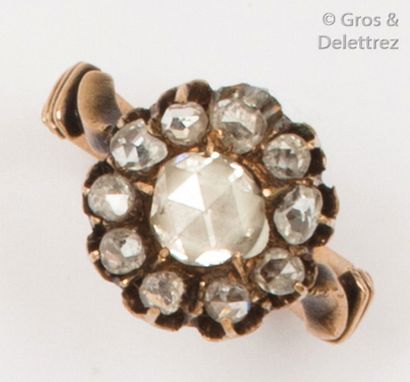 null Yellow gold ring, adorned with a rose-cut diamond in a ring of smaller diamonds....