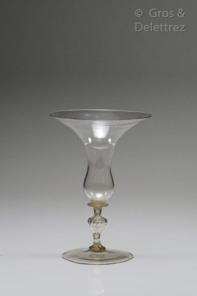 null Glass with a flared and curved campaniform cut resting on a disc and a twisted...