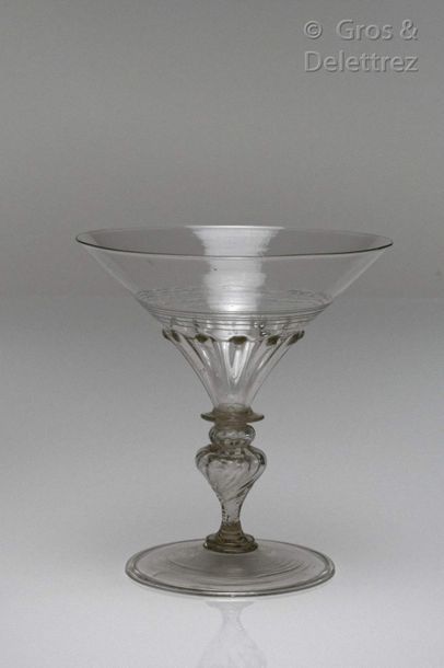 Glass with a conical cut decorated with ribs...