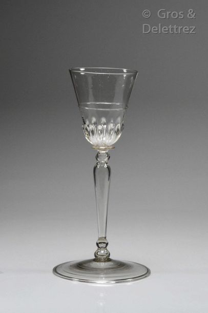Glass with a campaniform cut decorated with...