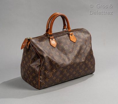 LOUIS VUITTON Bag "Speedy" 35 cm in Monogram canvas and natural leather, zip closure,...