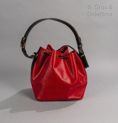 LOUIS VUITTON Bag "Petit Noé" 26cm in red leather and black leather, closing by a...