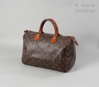 LOUIS VUITTON Speedy" bag 30cm in Monogram canvas and natural leather, zip closure,...