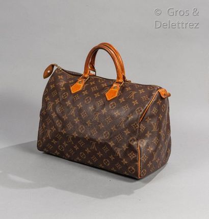 LOUIS VUITTON Bag "Speedy" 35cm in Monogram canvas and natural leather, zip closure,...