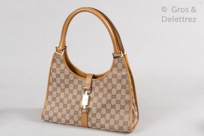 GUCCI Bag "Jackie" 31 cm in signed canvas and beige leather, tongue closure on chromed...