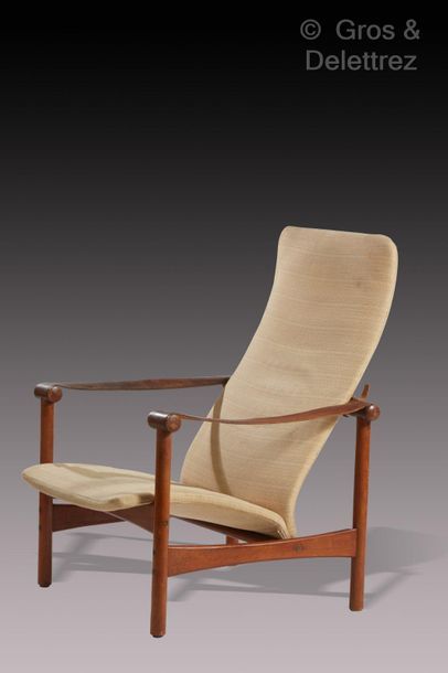 TRAVAIL SCANDINAVE Teak armchair with seat and backrest covered with beige fabric.

Circa...