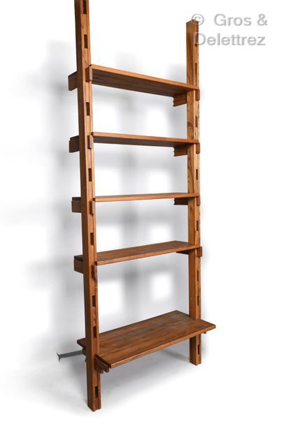 Pierre CHAPO (1927-1986) Set of elm bookcase shelves.

H: 267 cm