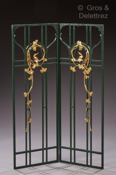 EDGAR BRANDT (1880-1960) Pair of black patinated hammered wrought iron grills with...