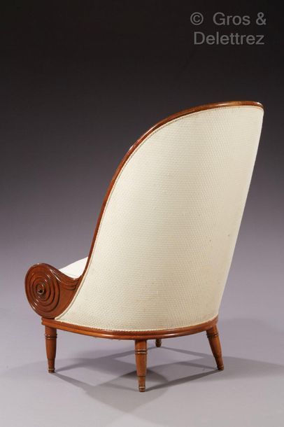 Paul IRIBE, d’après Armchair " Nautile " in carved moulded walnut, beige fabric upholstery....