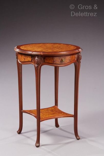Louis MAJORELLE (1859-1926) Moulded mahogany pedestal table carved with pine cone...