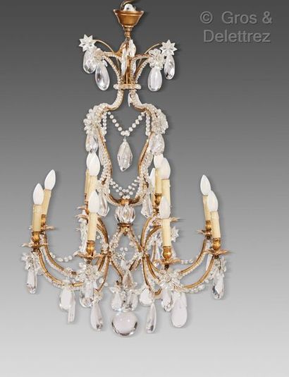 Maison BAGUÈS *Gilt metal frame chandelier enclosing eight light arms with foliage...