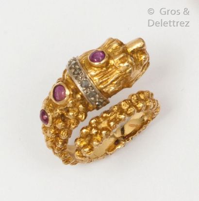 null Lion" ring in chased yellow gold, set with rose-cut diamonds and cabochon rubies....