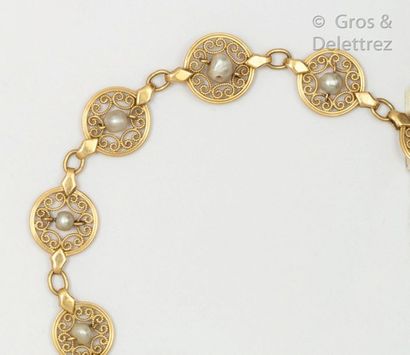 null Articulated yellow gold bracelet with round filigree links, each set with a...