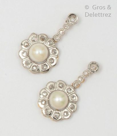 null Pair of yellow gold and white gold earrings, set with cultured pearls in an...