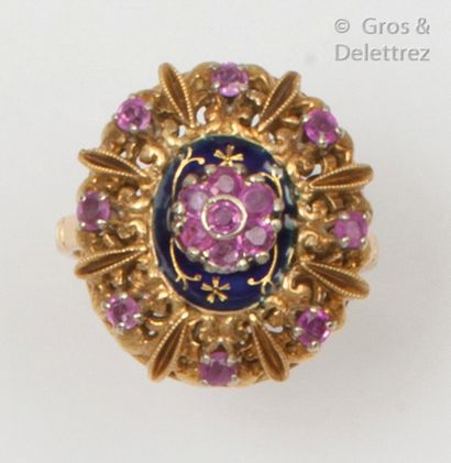 null Rosace" ring in chiselled yellow gold, partially enamelled blue and decorated...