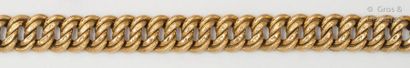 null Bracelet " Gourmette " in yellow gold partially braided. Ratchet clasp with...