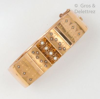 null Yellow gold "Opening rush" bracelet, decorated with a central motif of arabesques...