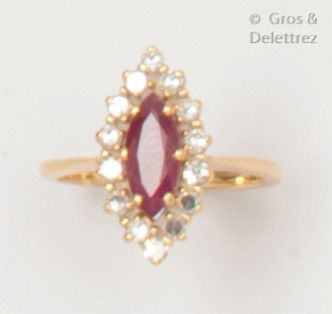 null Yellow gold ring set with a shuttle ruby in a ring of brilliant-cut diamonds....