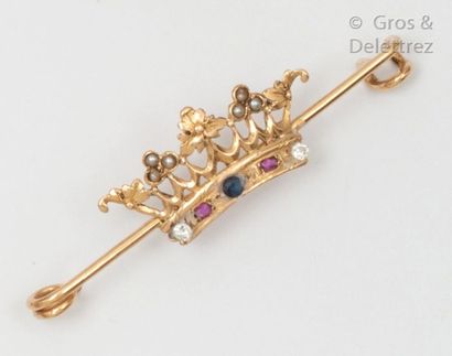 null Barette" brooch in yellow gold with a crown decoration, set with coloured stones....