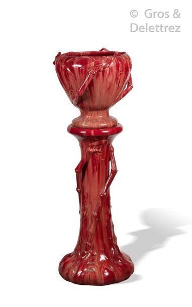 null Red glazed ceramic planter with relief decoration of branches and bamboo leaves....