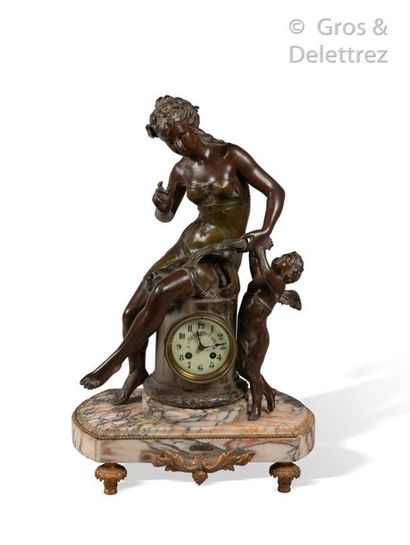 D’après Auguste MOREAU " Education " 

Sculpture in brown and green patinated ruler...