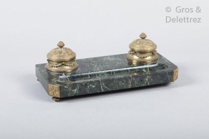 null Rectangular writing case in sea-green marble decorated with two covered inkwells...
