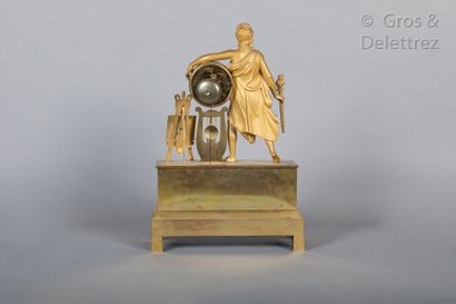 null A chased and gilt bronze clock representing Apollo or Orpheus (?) standing with...