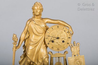 null A chased and gilt bronze clock representing Apollo or Orpheus (?) standing with...