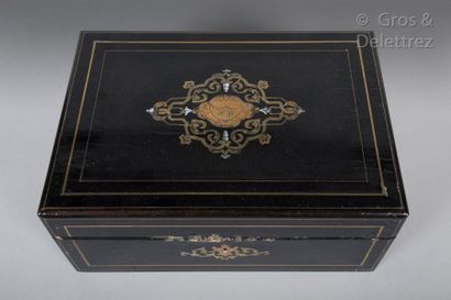 null Ebony veneer toiletry box, inlaid with fillets and a central brass motif, containing...