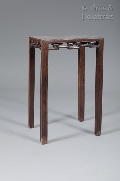 null Small rectangular rosewood table, the openwork belt with geometrical decoration,...