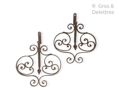 null Wrought iron decorative elements with scrolls facing each other around a lanceolate...