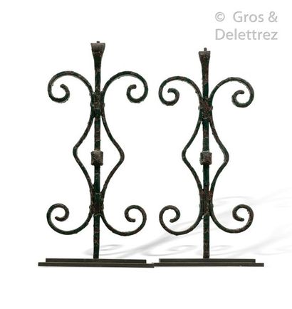 null Pair of decorative elements in green lacquered wrought iron with a motif of...