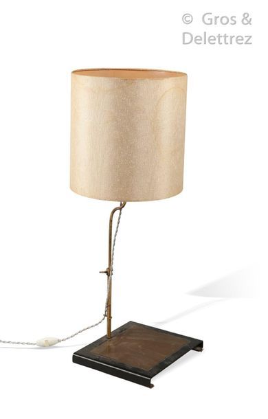 null Adjustable desk lamp resting on a base in black lacquered metal and brass 

Work...