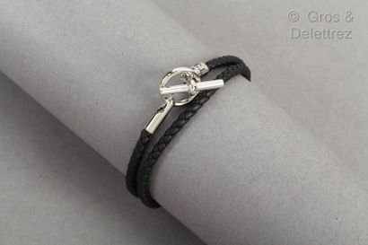 HERMES Paris *Bracelet " Le Glénan " in black braided leather, clasp rod in silver...