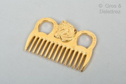 HERMES Paris *Gilt metal mane comb, topped with an equine pattern.