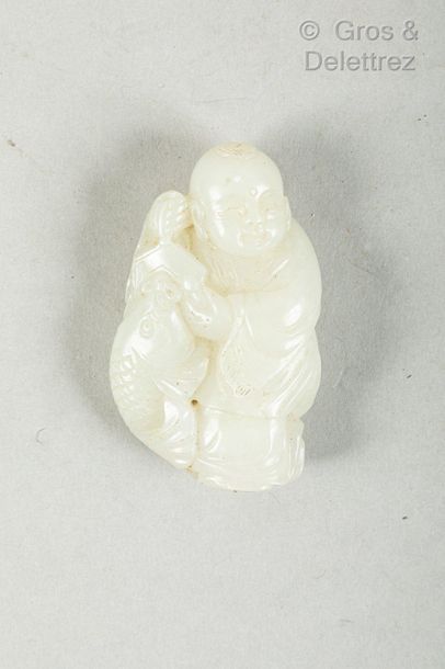null Chine, fin XIXe - début XXe siècle

Petit pendentif en jade céladon, représentant...