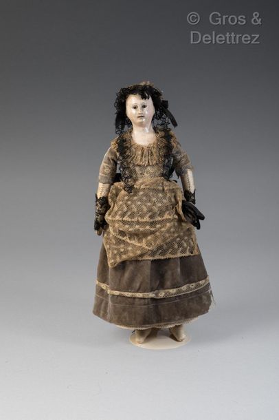 null Early French fashion doll from the Romantic Era.

This small model of “poupée...