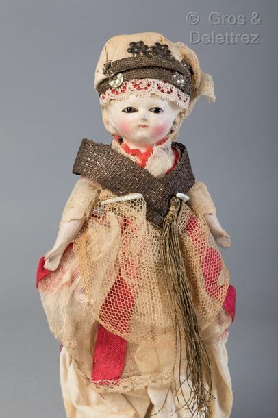 null Wax-coated papier-mâché headed doll in her original « Turkish style » costume

This...