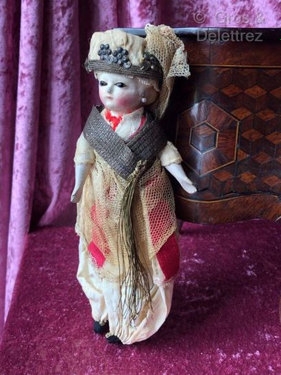 null Wax-coated papier-mâché headed doll in her original « Turkish style » costume

This...