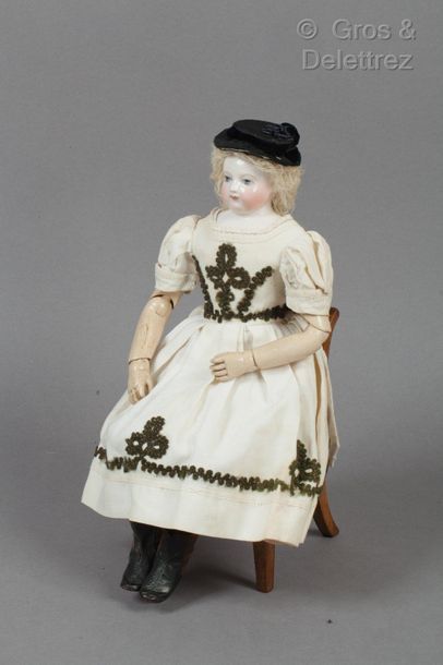 null Remarkable HURET doll with articulated wooden body

This porcelain doll with...