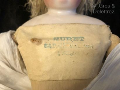 null Remarkable HURET doll with articulated wooden body

This porcelain doll with...