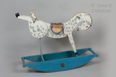 LOUIS VUITTON Rocking horse in painted wood, leather saddle. Signed label. (Wear,...