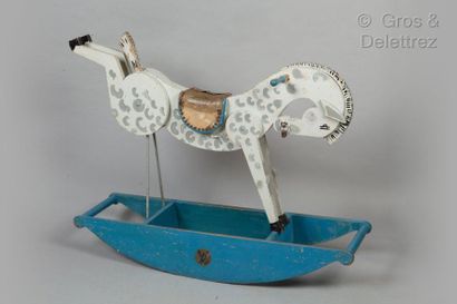 LOUIS VUITTON Rocking horse in painted wood, leather saddle. Signed label. (Wear,...