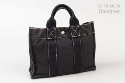 HERMÈS Paris made in France *Sac « Toto » PM 29cm en toile noire, fermeture pression,...