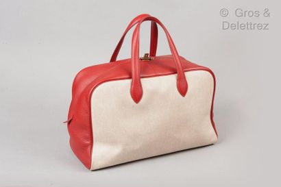 HERMÈS Paris made in France *Bag "Victoria" 43cm in beige mottled canvas and red...