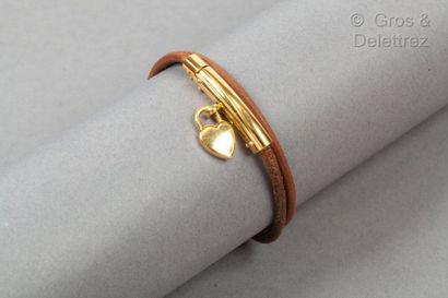 HERMES Paris *"Double or Double" double-twist bracelet in natural leather, golden...