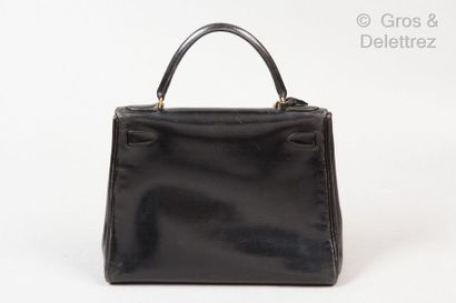 HERMES Paris *Bag " Kelly Retourné " 29cm in black box, gold plated fasteners and...