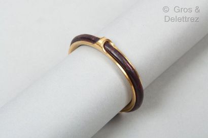 HERMES Paris *Bracelet open rush in gold metal covered with burgundy leather. (Wear,...